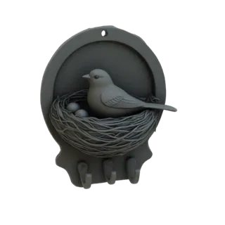 3D-модель декоративного настенного крючка с птицей в гнезде, тремя яйцами и тремя крючками внизу.