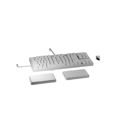 3D-модель корпоративной клавиатуры, вид три четверти спереди, окно Unity, показывающее пластиковые силуэты настольного размер