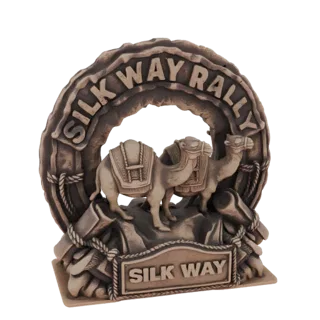3D-модель каравана верблюдов Silk Way Rally с двумя верблюдами, скалистой местностью и надписью 'SILK WAY RALLY'.