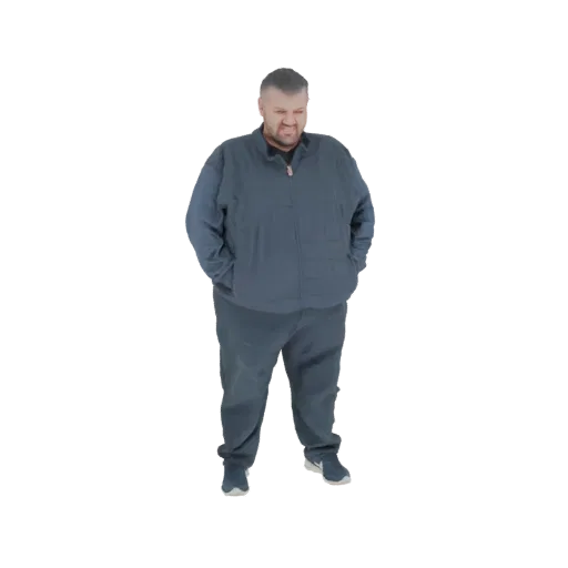 3D модель мужчины в темной стеганой куртке и серых спортивных штанах, стоящего с руками в карманах.