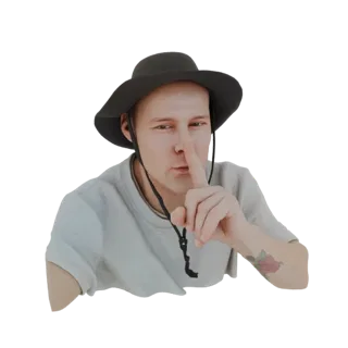 3D модель мужчины в темной шляпе, делающего жест "тише" пальцем у губ, видна татуировка розы на руке.