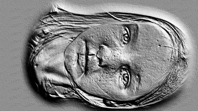 3D модель барельефа женского лица с детализированными волосами, выполненная в монохромной гамме.