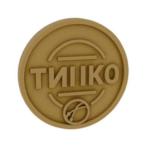 3D модель золотой монеты TIKO с рельефной надписью и круглой эмблемой на черном фоне.