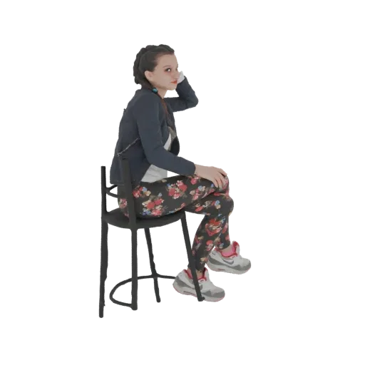 3D модель молодой женщины с косами, в темной куртке и леггинсах с цветочным принтом, сидящей на темном стуле.