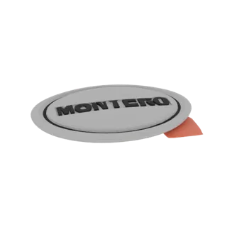 3D model of a silver oval Montero emblem with raised black text, showing a slight orange backing.